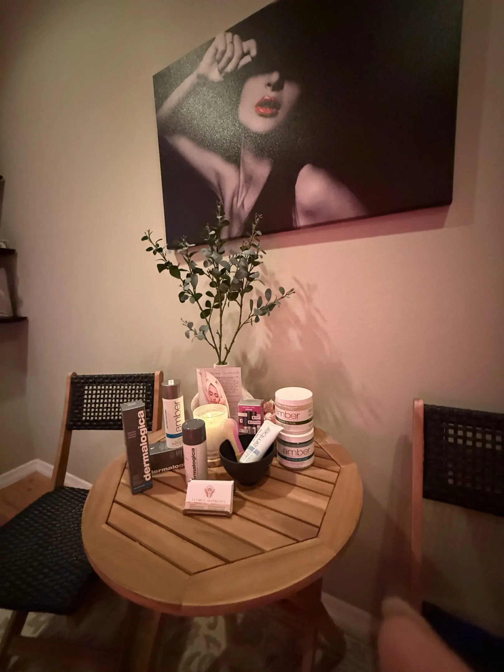 A table with candles and makeup on it
