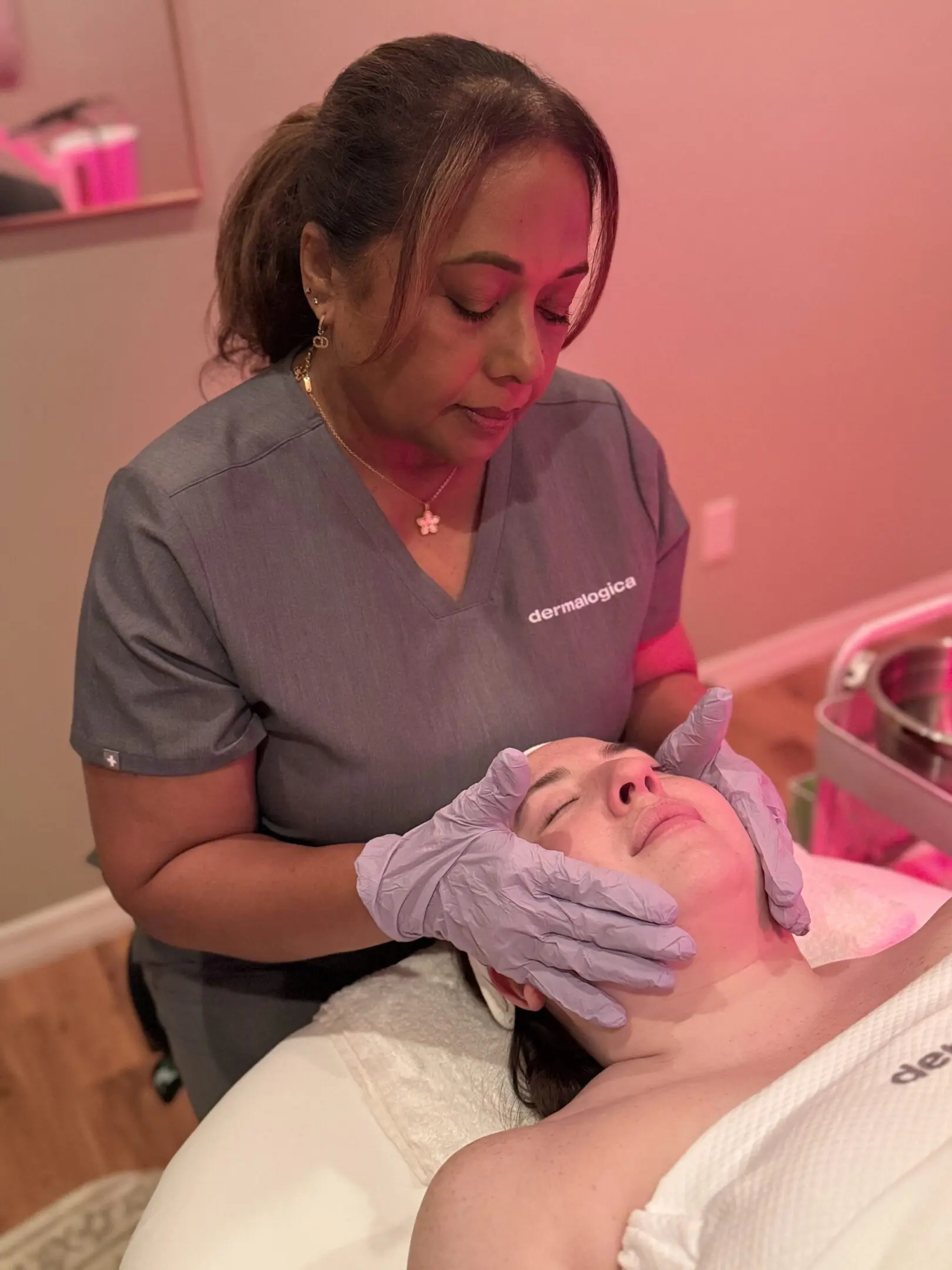 A woman is getting her face washed