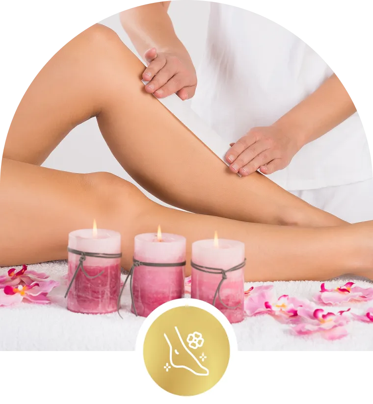 Massage therapy session with candles and flowers.